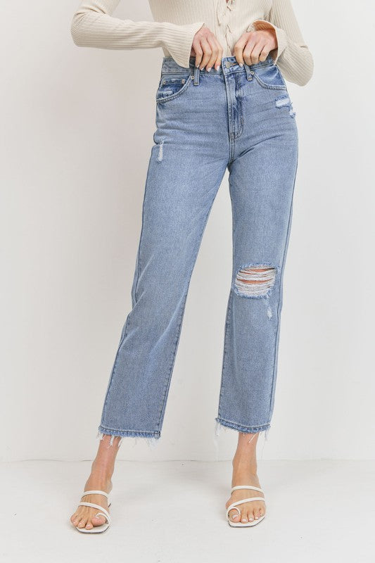 Relaxed straight leg jeans with distressed knee and hem