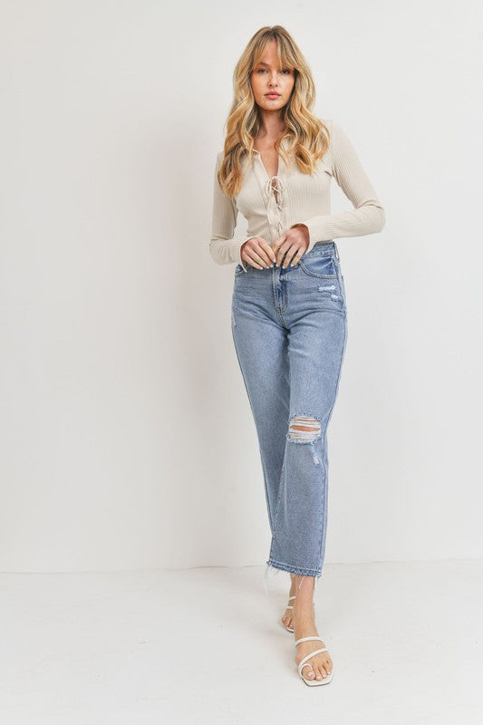 Relaxed straight leg jeans with distressed knee and hem