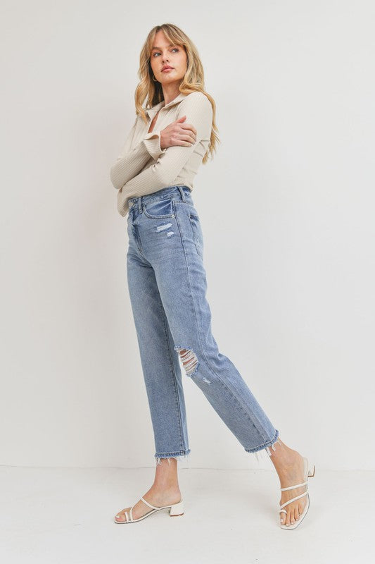 Relaxed straight leg jeans with distressed knee and hem